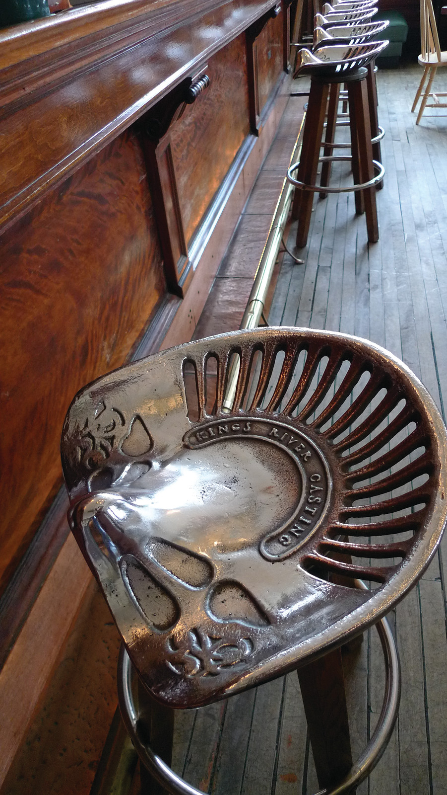 Comfy cast iron tractor seat stools thirteen of clubs — historic image