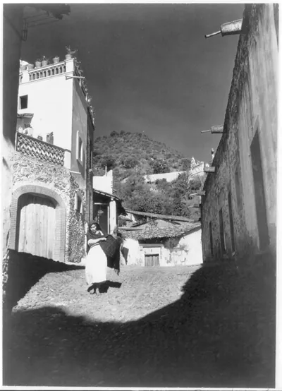 [Mexico - Taxco, Guerrero district - woman walking in picturesque alley]