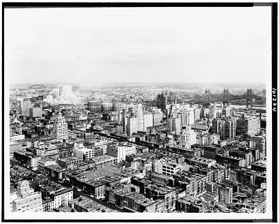 [Bird's-eye view of New York City, with the 59th Street (Queensboro) Bridge in the background]