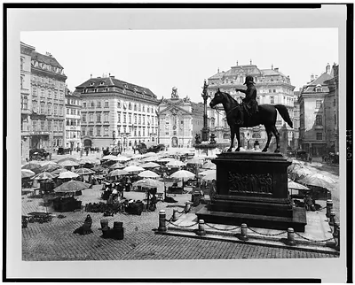 [Am Hof, Vienna, Austria, with open air market and equestrian statue in foreground]