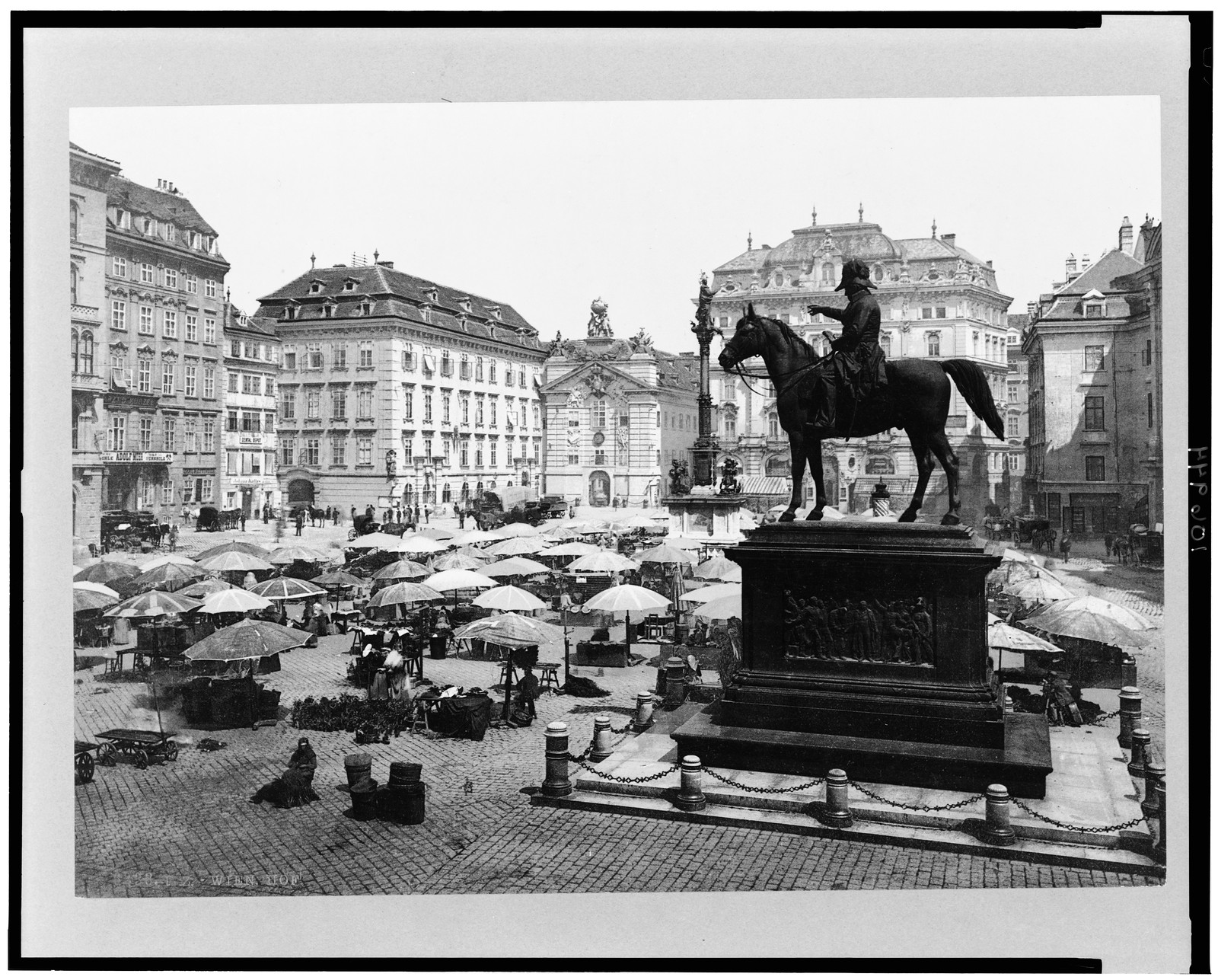 [Am Hof, Vienna, Austria, with open air market and equestrian statue in foreground], [between 1890 and 1900] — historic print