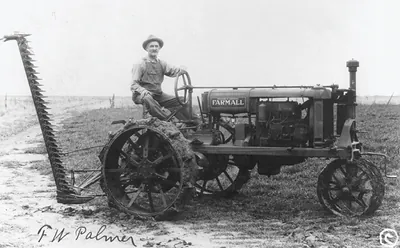 [Man operating a McCormick Deering Famrall tractor and reaper]