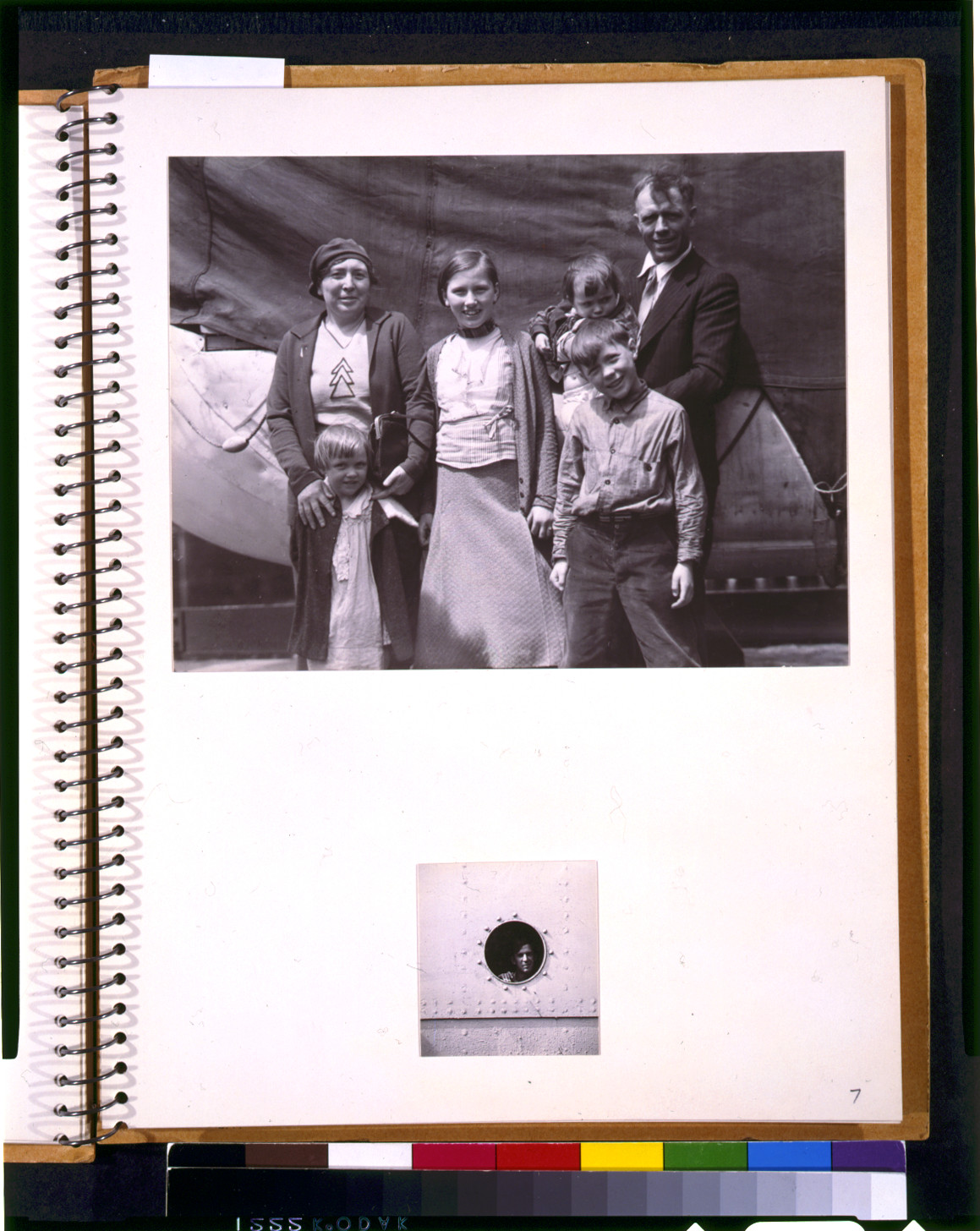 [Two scenes aboard the U.S.A.T. St. Mihiel: A family group posing on deck, and a man looking through a porthole], [1935 May] — historic photograph