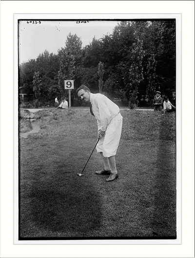 James playing golf