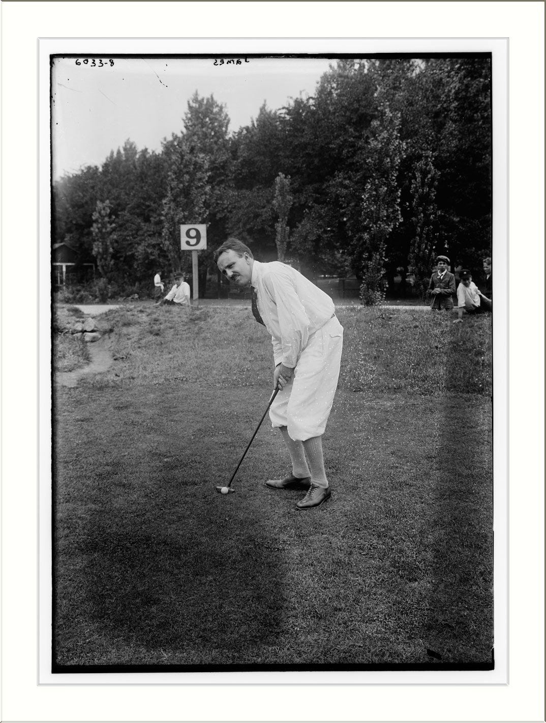 James playing golf, n/a — historic photograph