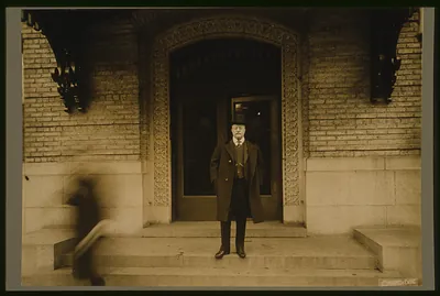 [Theodore Roosevelt, full-length portrait, standing, facing front, in front of doorway]