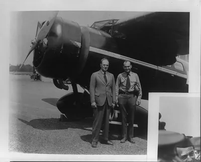 [Official air force photographs of Ira Eaker and his contemporaries: 2 men posed by airplane]