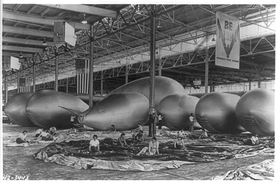 Barrage balloon seams being cemented and inspected by women war workers