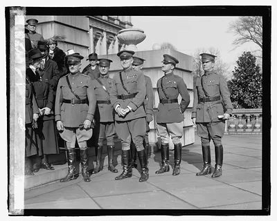 [Unidentified uniformed men, ceremony on steps]