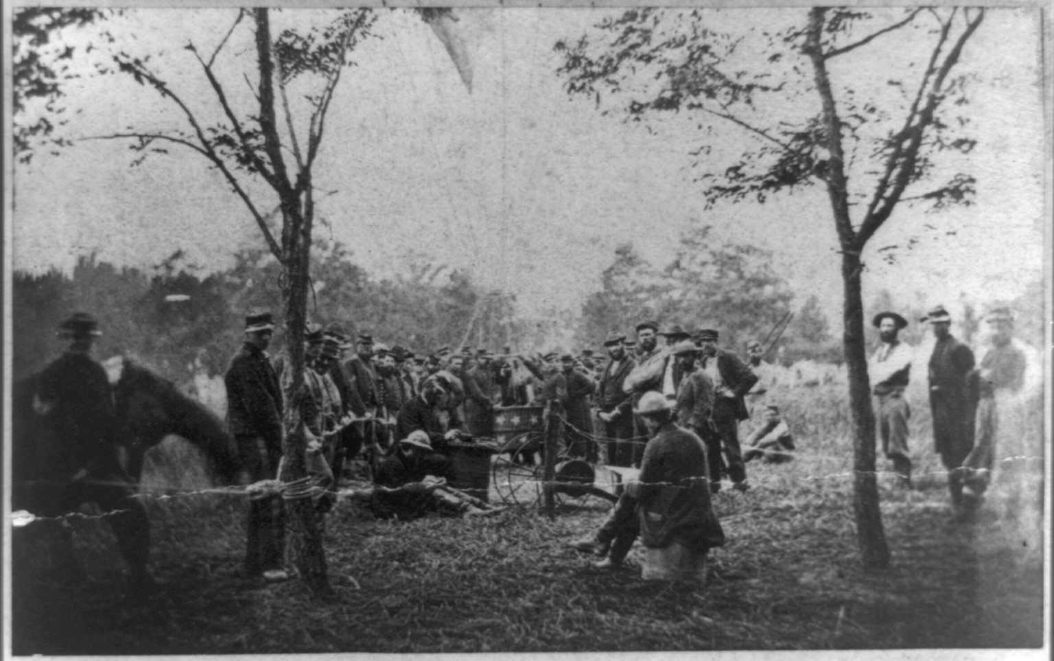 [Prof. Thaddeus Lowe's Balloon Camp" at Gaines Mill May 1862: Lowe prepares to ascend; soldiers crowded around car of balloon]", [no date recorded on caption card] — historic image