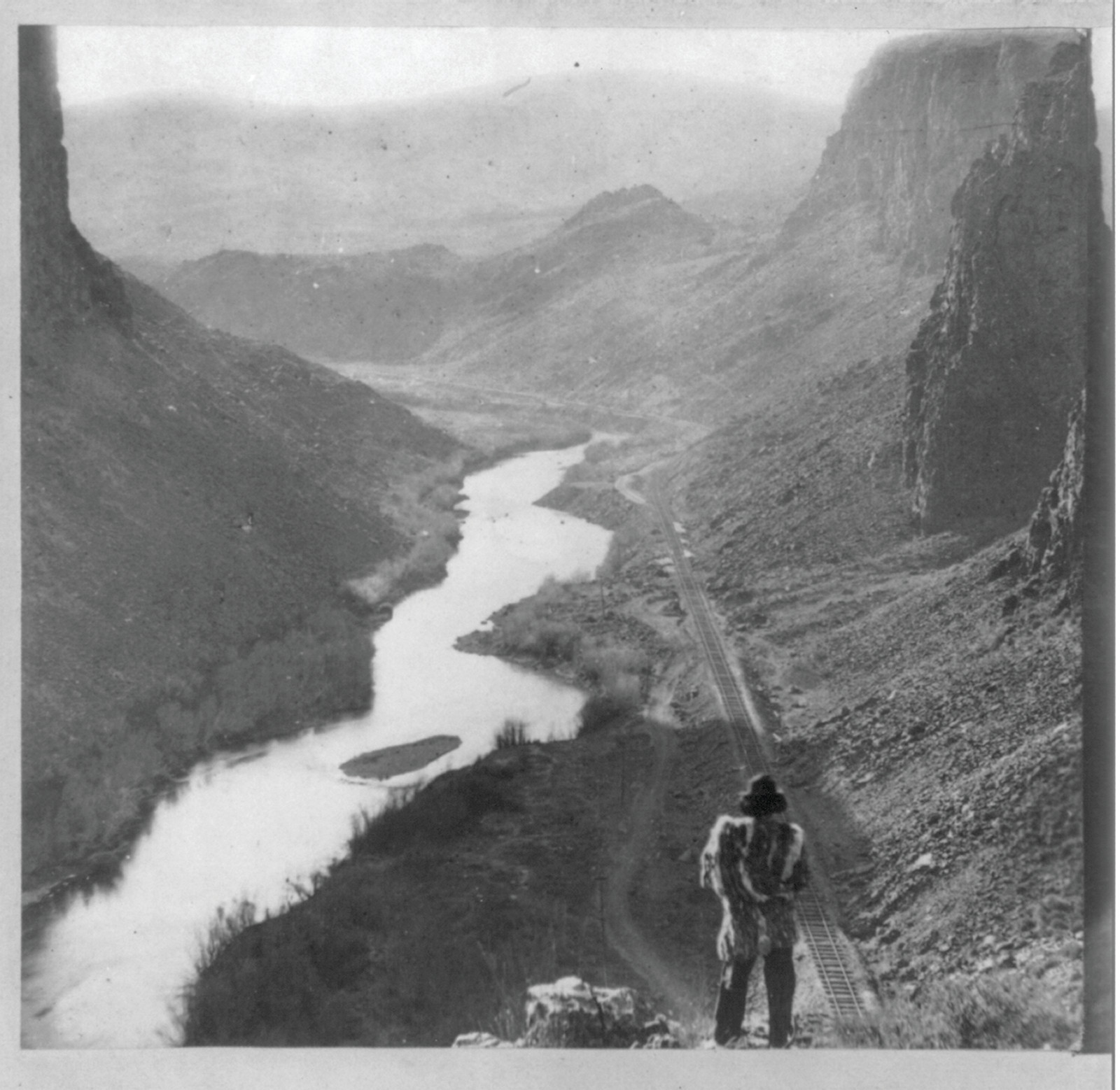 Indian viewing railroad from top of Palisades. 435 miles from Sacramento, Sacramento, Calif. : Golden State Photographic Gallery, [between 1865 and 1869] — historic photograph