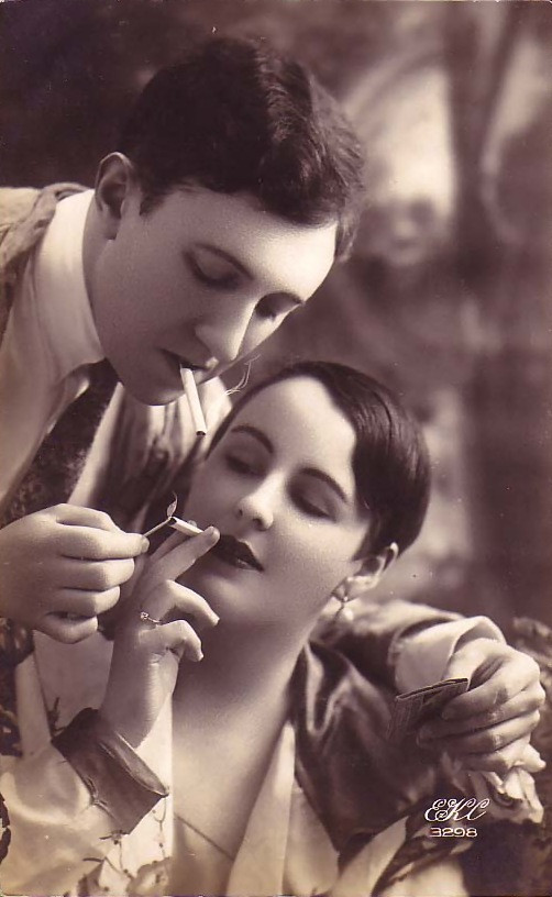 Couple sharing a cigarette, sepia postcard — vintage postcard