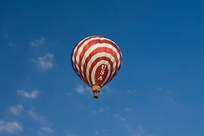 Red and white striped hot air balloon marked USA