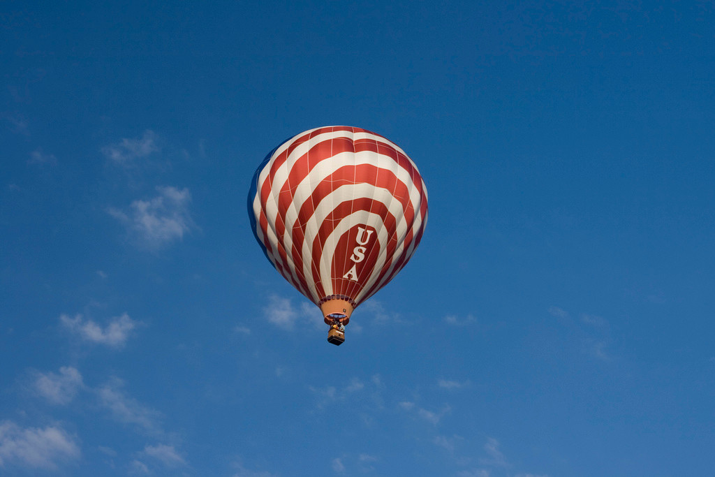 Red and white striped hot air balloon marked USA — historic image