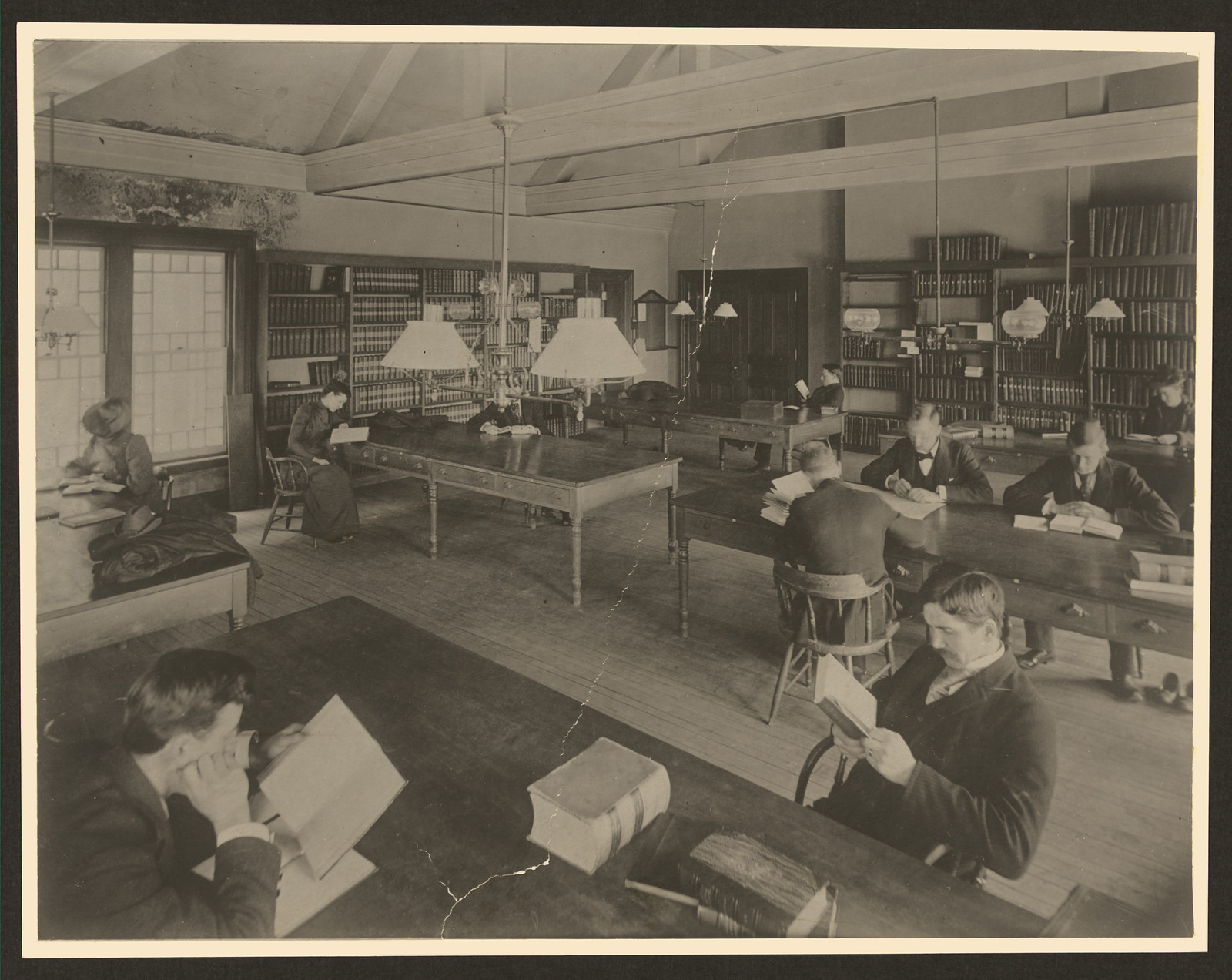 Patrons reading in a library reading room — historic image