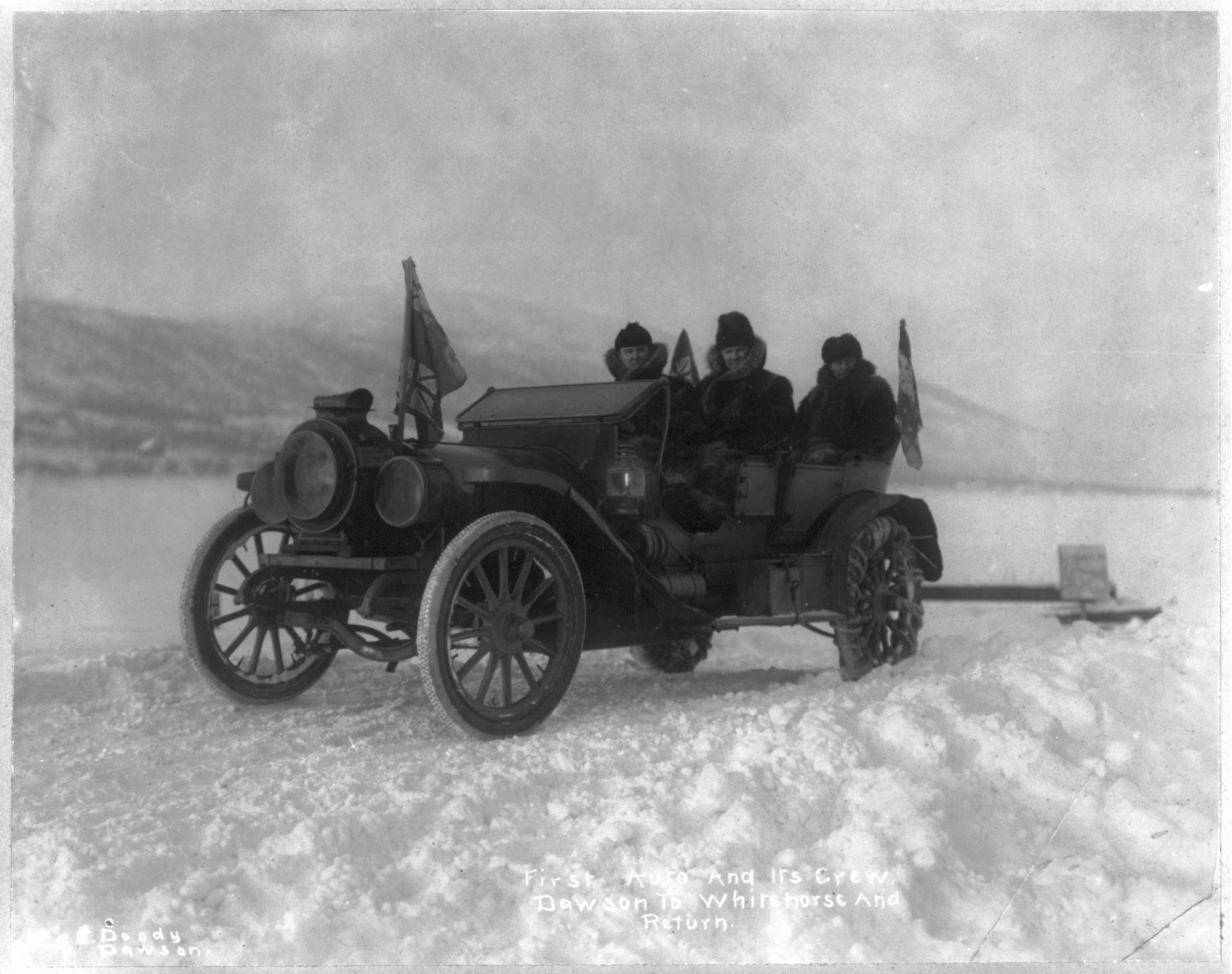 First auto and its crew to go from Dawson to Whitehorse and return, 1912 Dec. — historic photograph