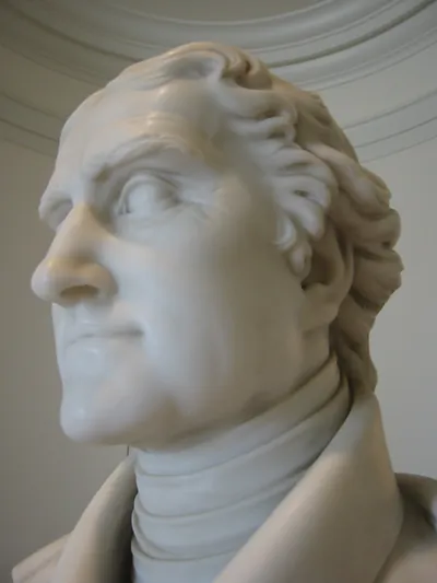 Close-up of a white marble bust of a man