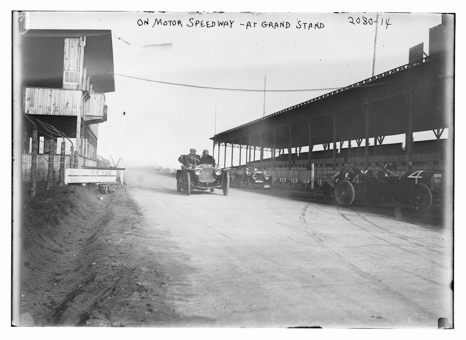 On motor speedway - at grand stand, n/a — historic photograph