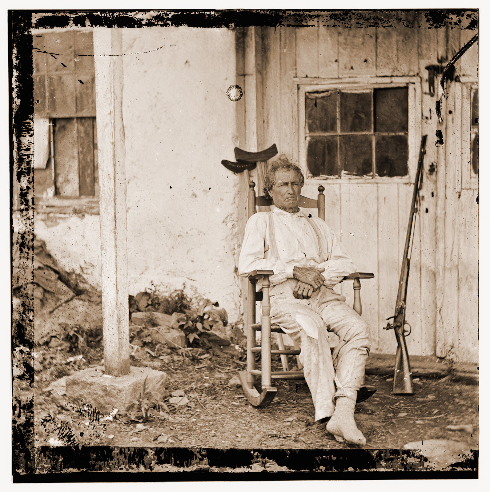 Gettysburg Pennsylvania. John L. Burns the old hero of Gettysburg with gun and crut, 1863 — historic photograph