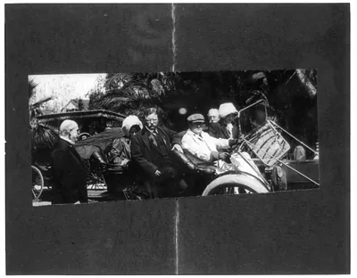 Theo. Roosevelt about to get out of open car