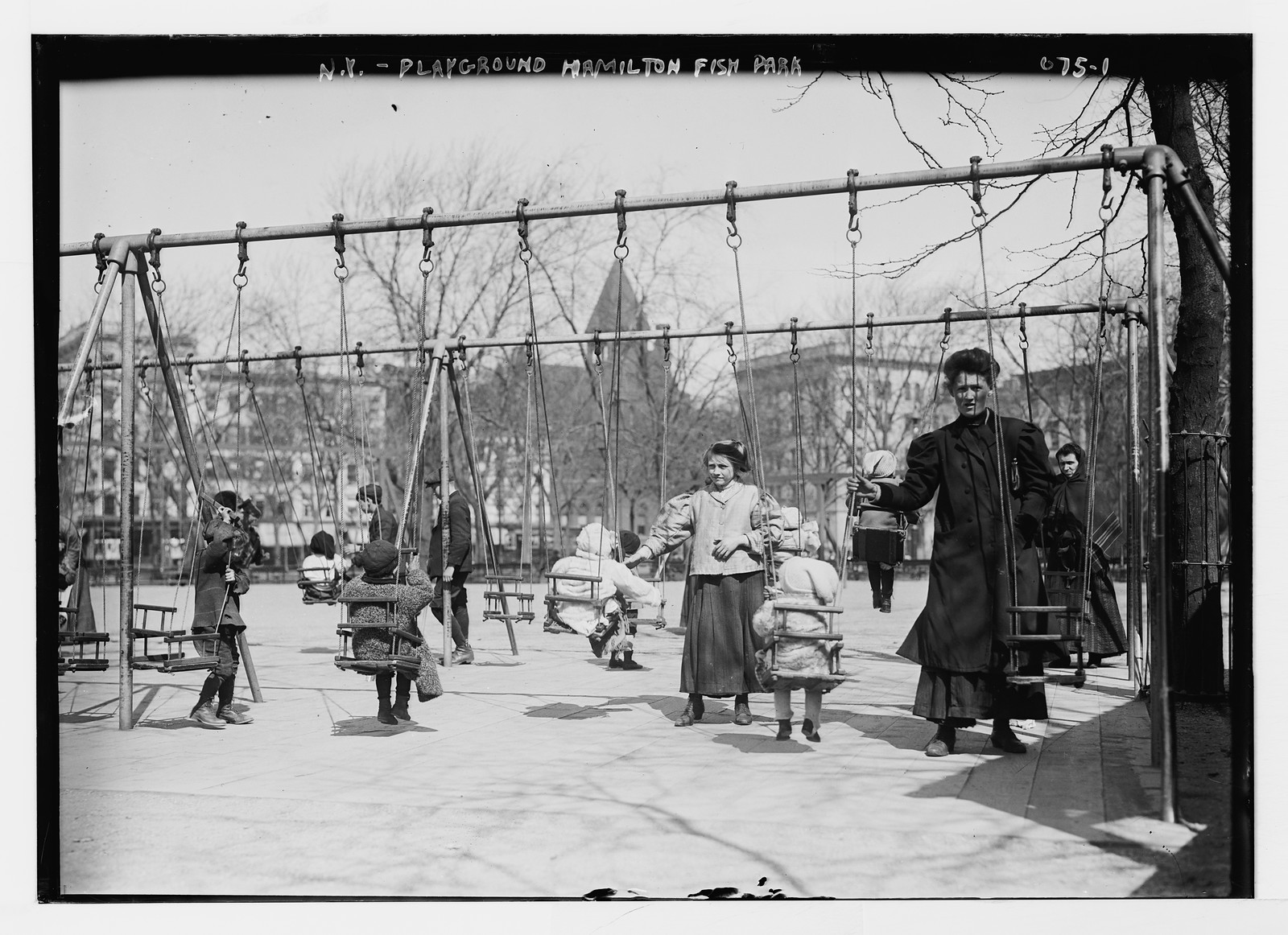 Children in swings, Hamilton Fish Park, New York, n/a — historic photograph