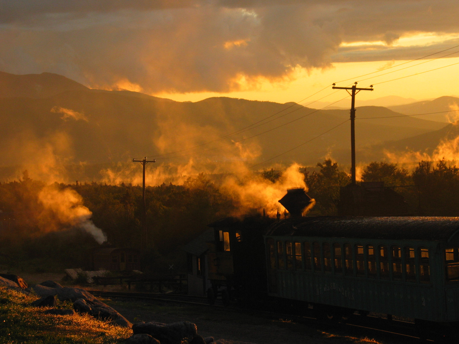 Steam train at sunset in hill country — historic image