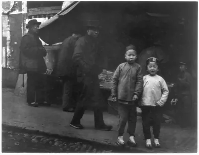 [San Francisco Chinatown, 1900?: street market scene; 2 boys facing camera]