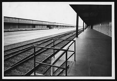 Railroad tracks beside a covered loading platform