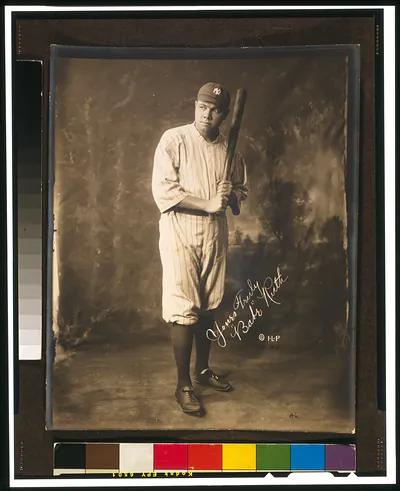 [Babe Ruth, full-length portrait, standing, facing slightly left, in baseball uniform, holding baseball bat] / Irwin, La Broad, & Pudlin.
