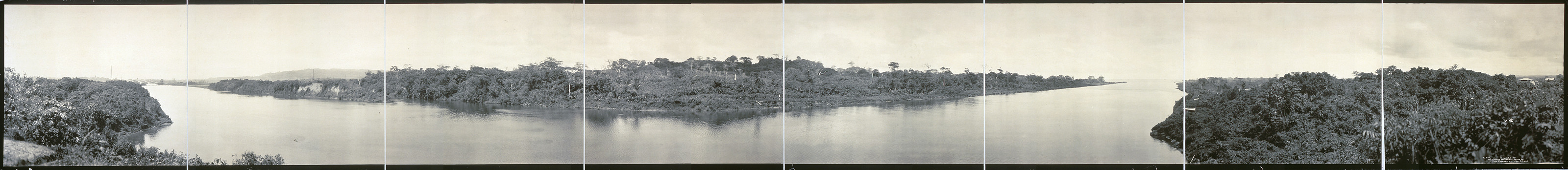 Panoramic view of a tropical waterway with forested banks — historic image