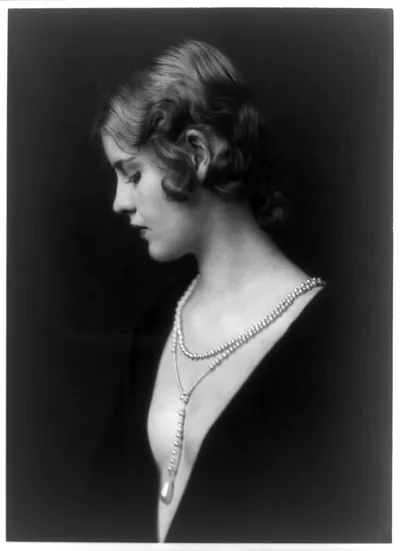 [Cala Eric, Ziegfeld girl, half-length portrait, left profile, wearing low-cut gown]