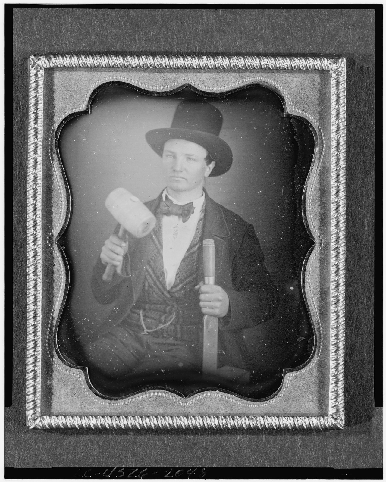 Daguerreotype occupational portrait of a man with mallet and chisel, 1840 — historic photograph