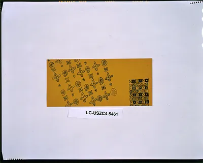 Yellow card with black stars, spirals and checked pattern