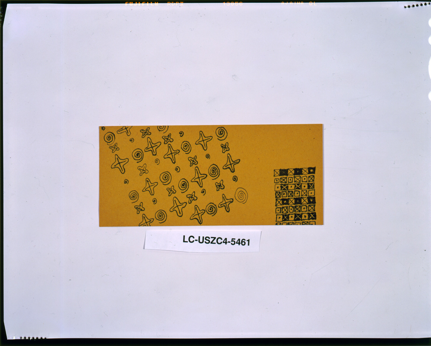 Yellow card with black stars, spirals and checked pattern — historic image