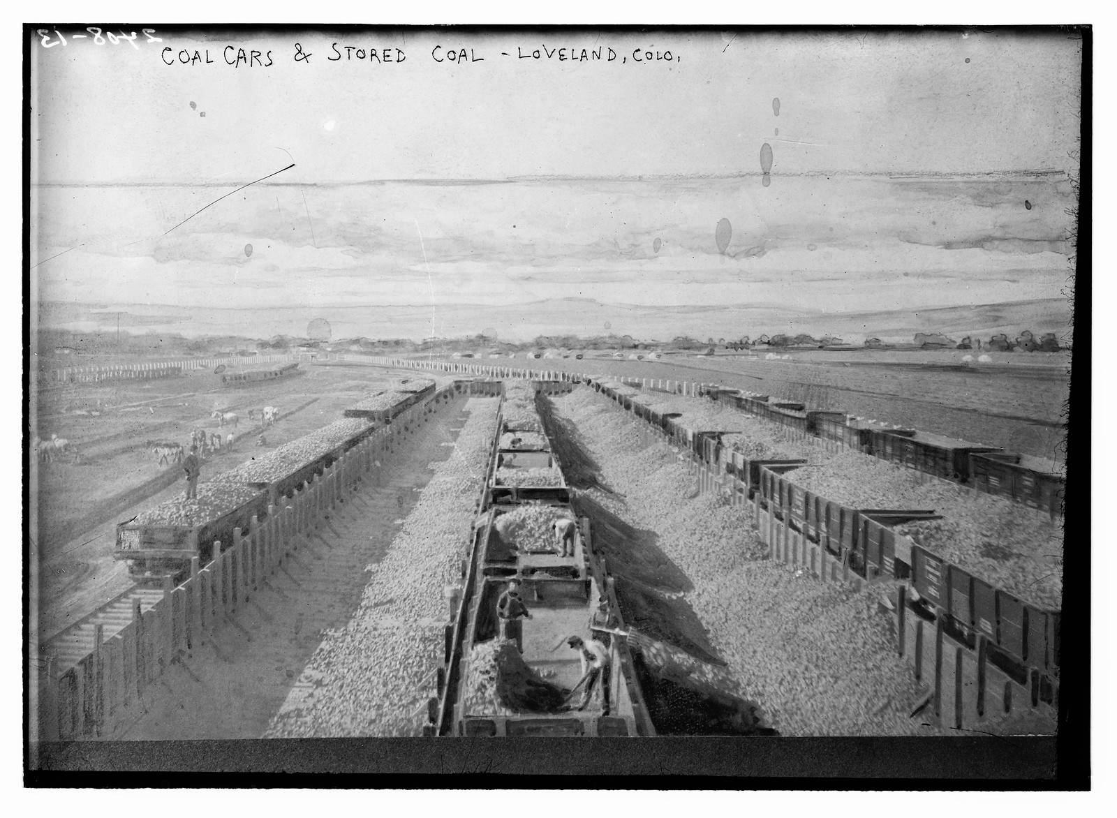 Coal cars and stored coal, Loveland, Co., n/a — historic photograph