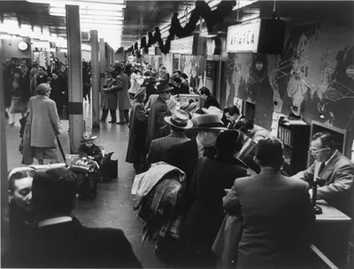 Stream of passengers at New York International Airport where about 15,000 travellers weekly ... arrived and departed for foreign countries in 1951