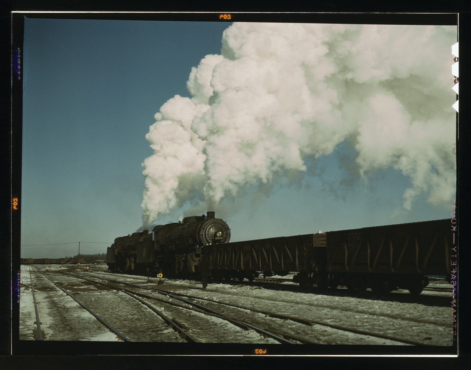 locomotive in a railroad yard — historic image