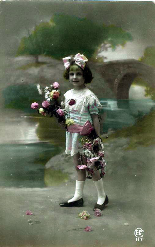 Hand-tinted postcard of a girl with flowers — vintage postcard