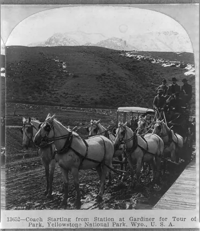 Coach starting from station at Gardiner for tour of Yellowstone National Park, Wyo.