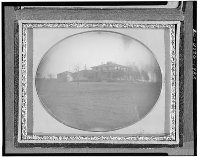 [Distant view of a house and yard]