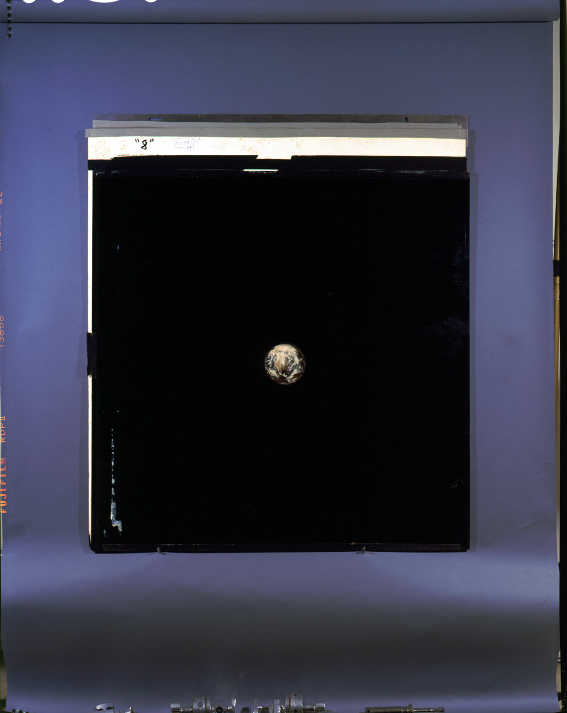Earth seen from space on a film transparency — historic image