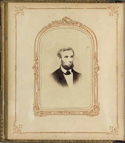 Sepia portrait photograph of a bearded man in an ornate album mount