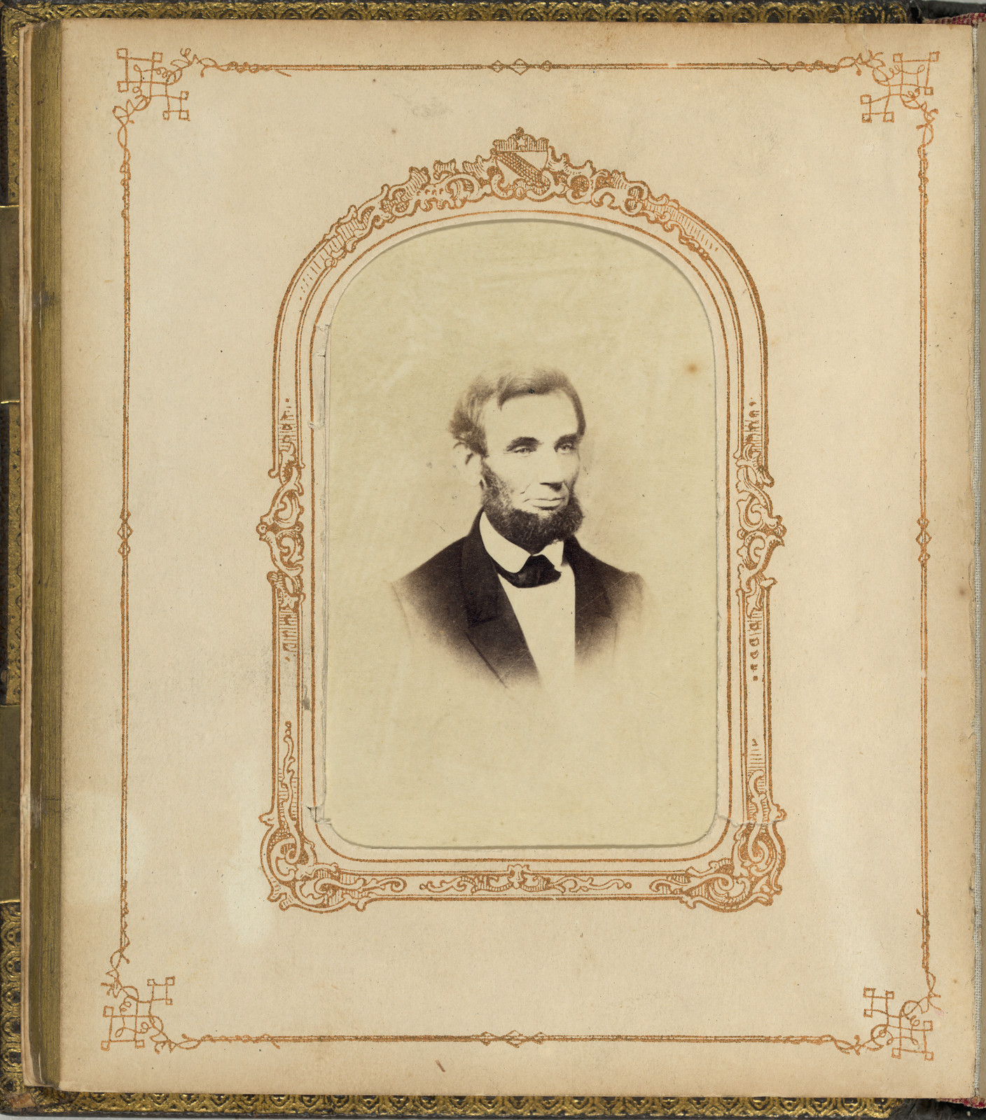 Sepia portrait photograph of a bearded man in an ornate album mount — historic photograph