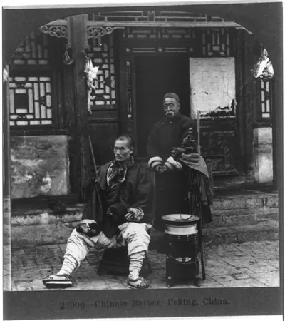 Chinese barber [and customer], Peking, China