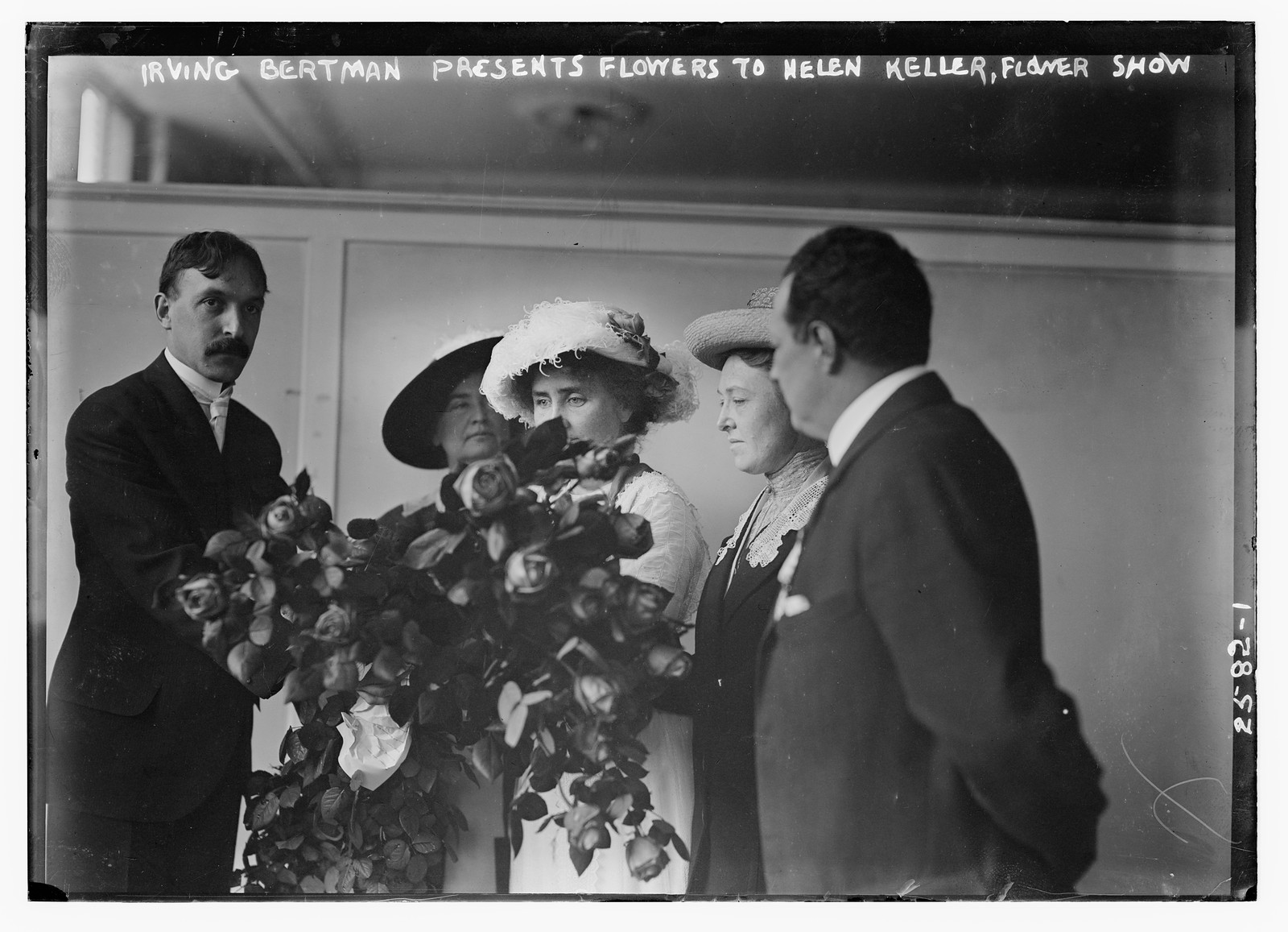 Irving Bertman presents flowers to Helen Keller, Flower Show, n/a — historic photograph
