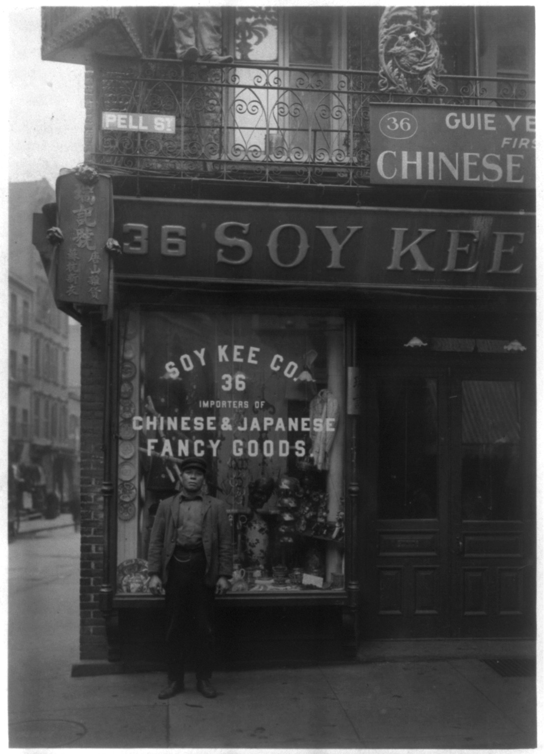 Soy Kee Co. store front, with Chinese man standing in front, Chinatown, New York City, c1903 Feb. 18. — historic photograph