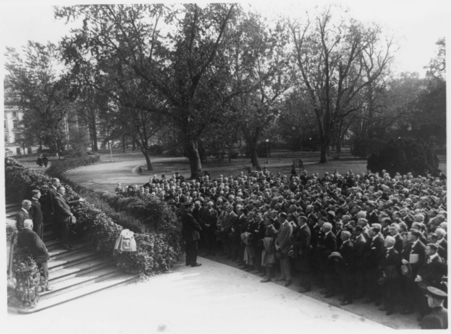 [Calvin Coolidge speaking to crowd from steps of White House(?)], [between 1924 and 1928] — historic photograph