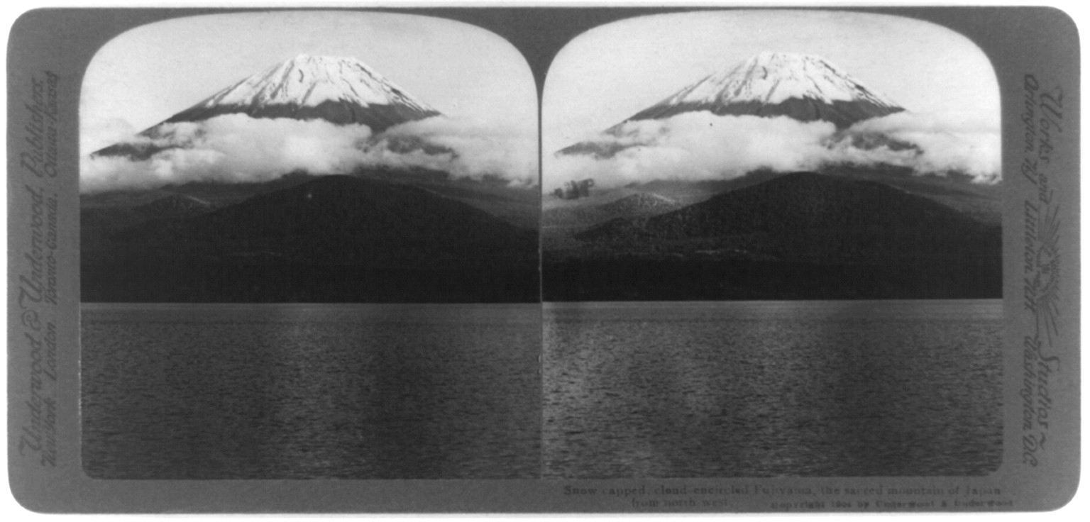 Snow-capped, cloud-encircled Fujiyama, the sacred mountain of Japan from the northwest, c1904. — historic photograph
