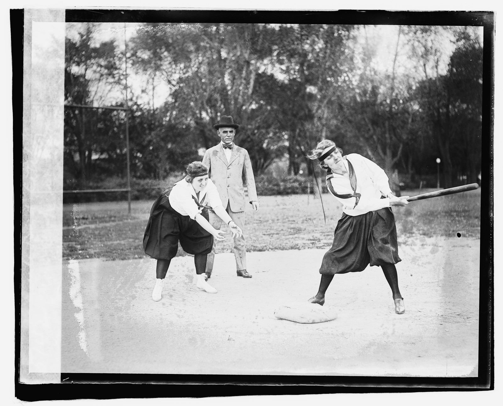 Lucile Boyd catching; Mary Cook at bat, [1919] — historic photograph