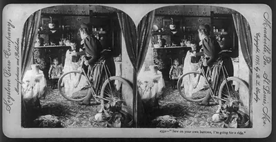 Stereograph of a woman in a room with a bicycle, "Sew on your own buttons, I'm going for a ride.